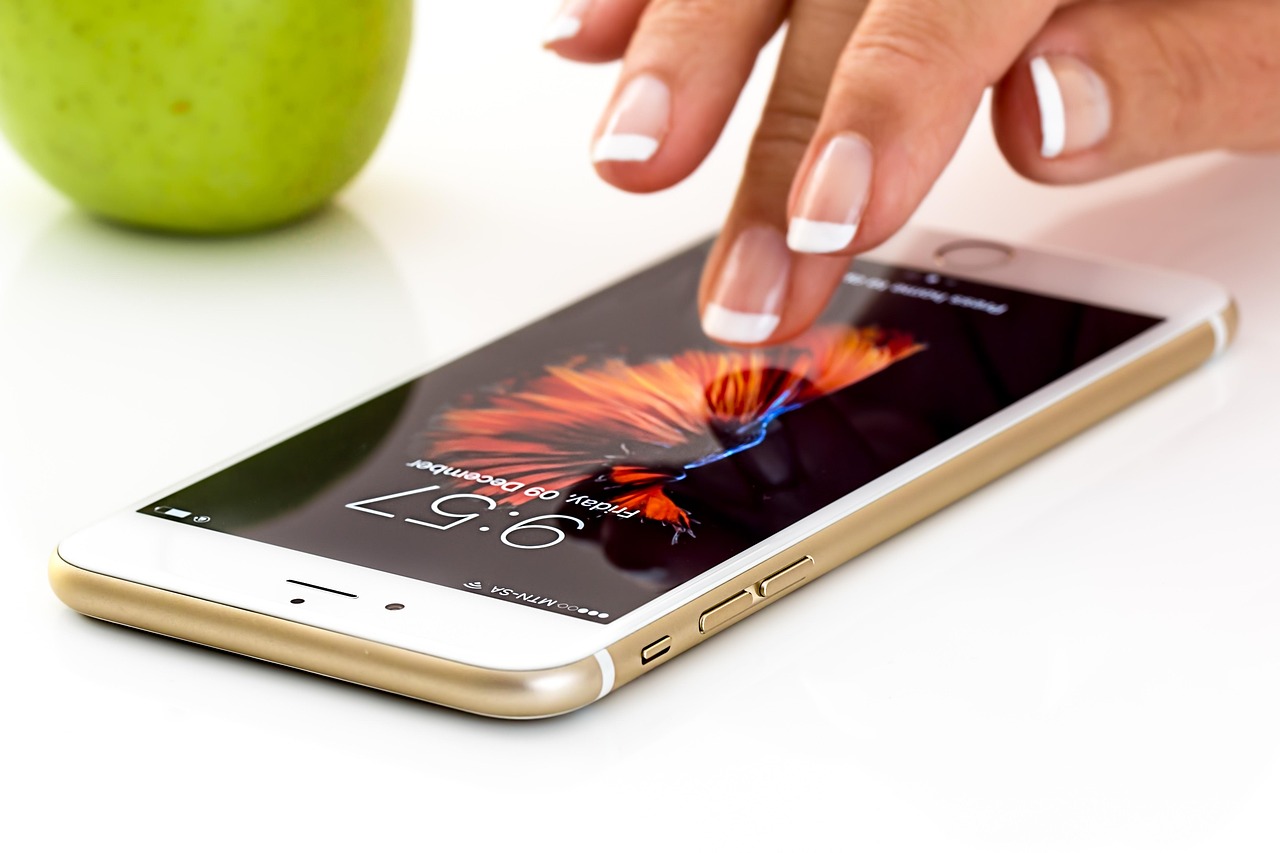 A finger tapping a smartphone screen
