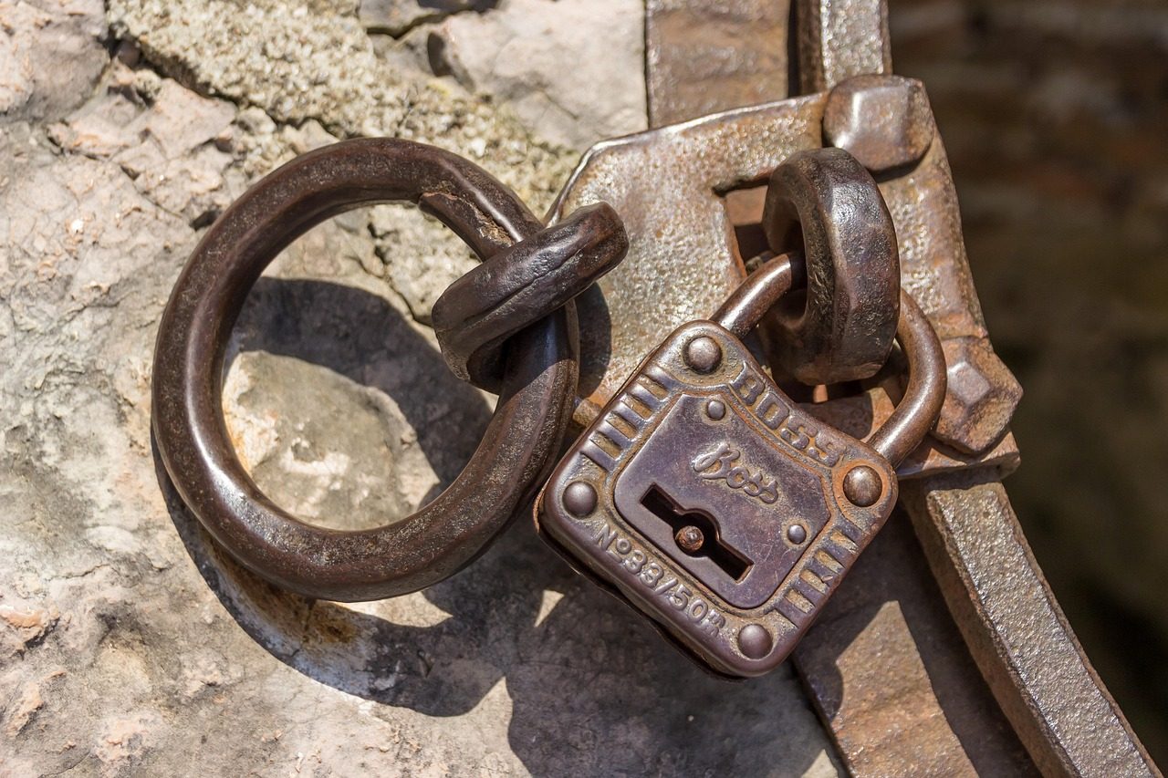 An old padlock with a keyhole, symbolising a key that locks and unlocks