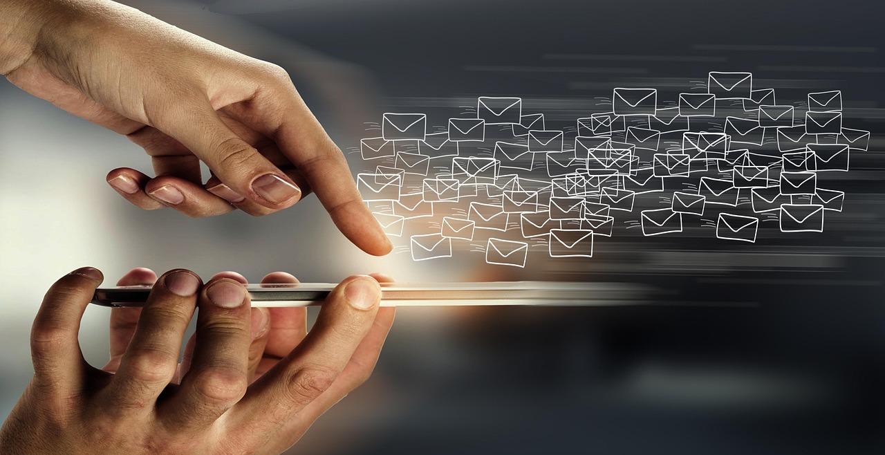 A smartphone with email envelope icons flowing from it, illustrating sending and receiving email.
